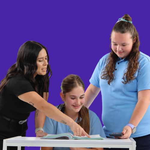 Teacher guiding high school students at Aced It Tutoring
